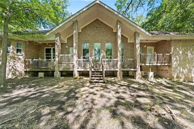 rear view of property featuring a porch