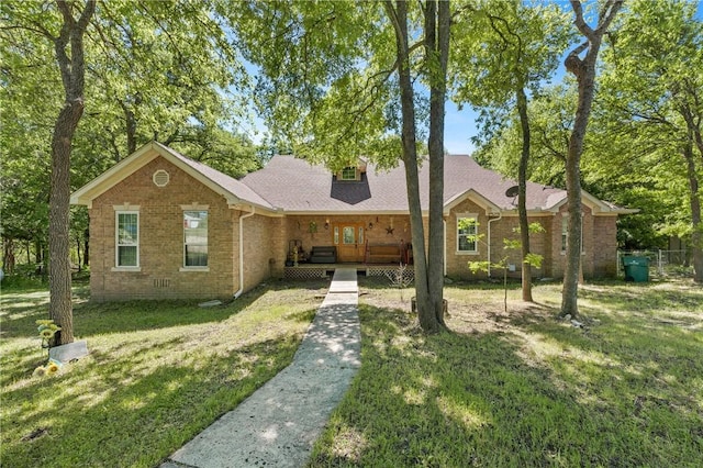 single story home featuring a porch and a front lawn