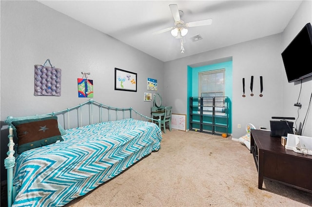 bedroom featuring ceiling fan and carpet