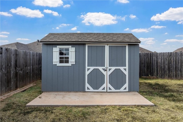 view of outbuilding featuring a yard