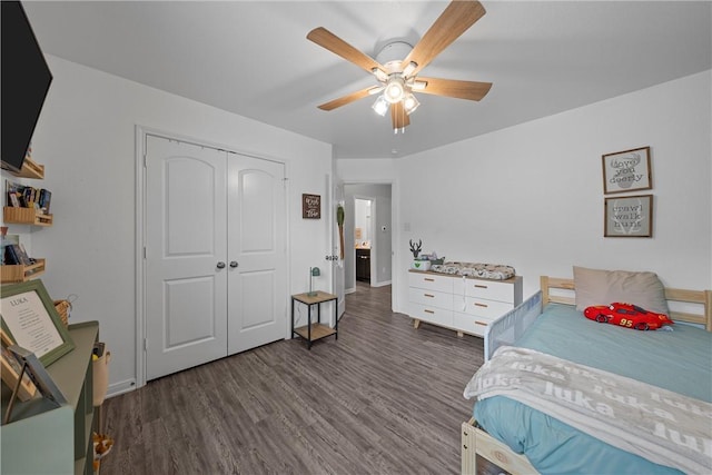 bedroom with a closet, ceiling fan, and dark wood-type flooring