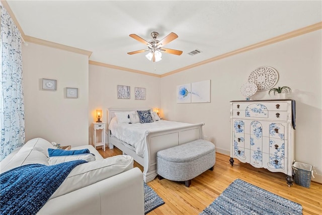 bedroom featuring wood-type flooring, ceiling fan, and crown molding