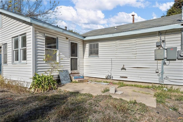 view of side of property featuring a patio