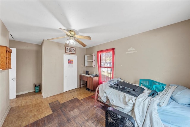 bedroom featuring ceiling fan and parquet flooring