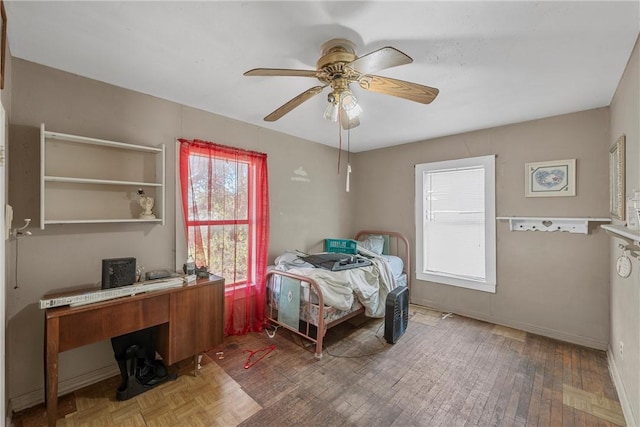 bedroom with wood-type flooring and ceiling fan