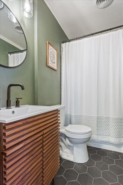 bathroom featuring vanity, tile patterned floors, toilet, ornamental molding, and curtained shower