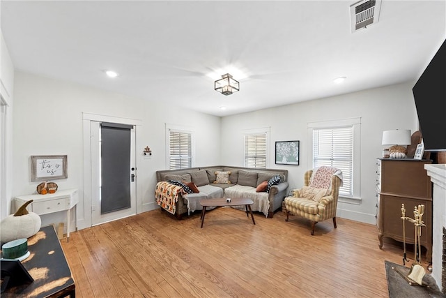 living room with light hardwood / wood-style flooring