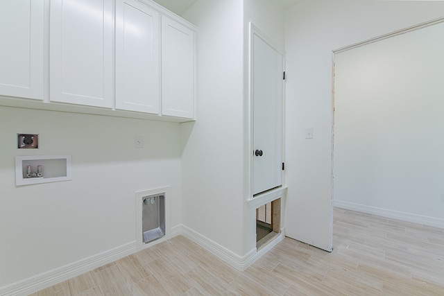 laundry area featuring washer hookup, electric dryer hookup, cabinets, and light wood-type flooring