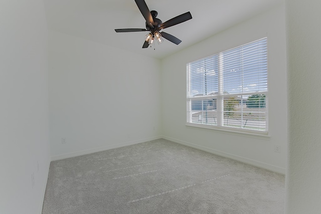 carpeted empty room with ceiling fan