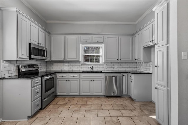 kitchen with backsplash, stainless steel appliances, ornamental molding, and sink