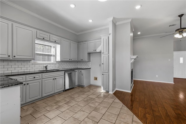 kitchen with gray cabinetry, ceiling fan, dishwasher, crown molding, and light tile patterned floors