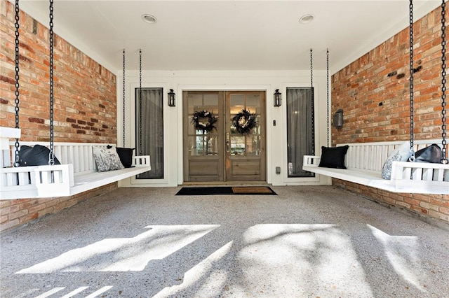 doorway to property with french doors and a porch