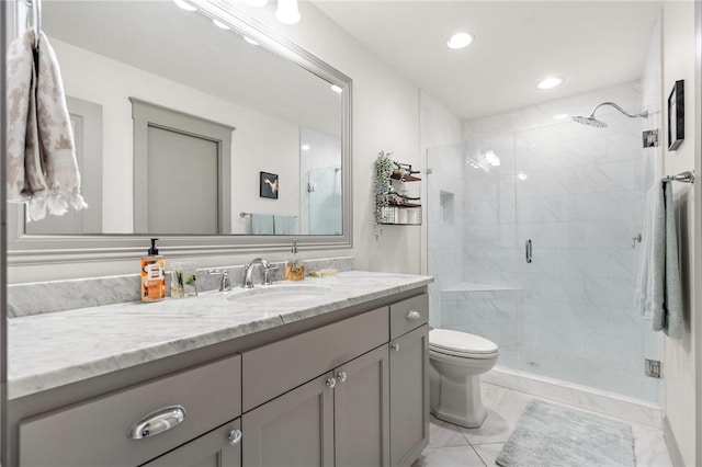 bathroom with vanity, toilet, and walk in shower