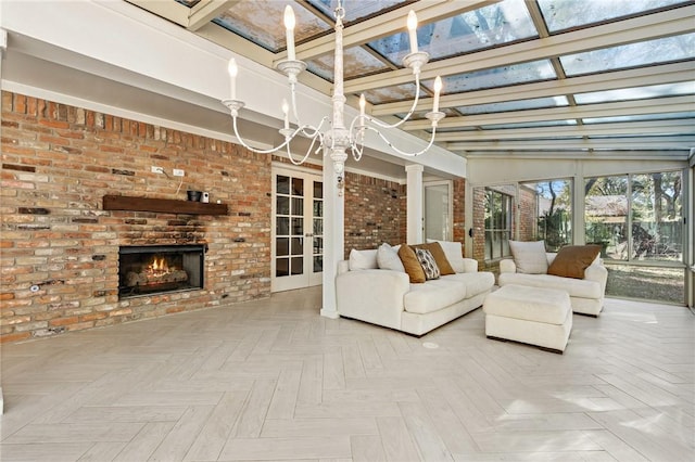 interior space with vaulted ceiling and a brick fireplace