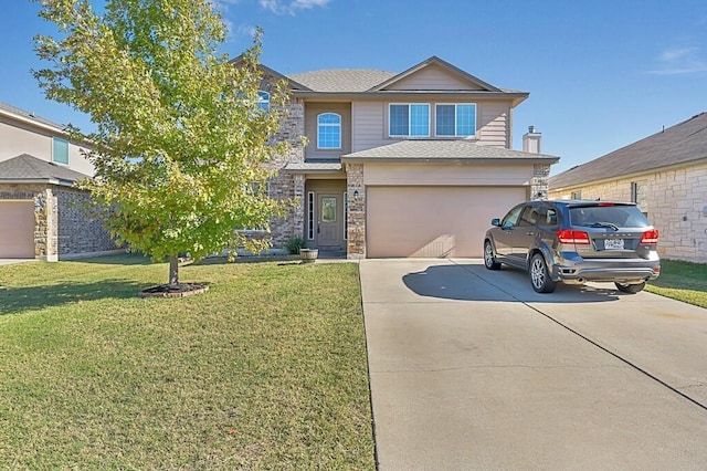 view of front of home with a garage and a front lawn