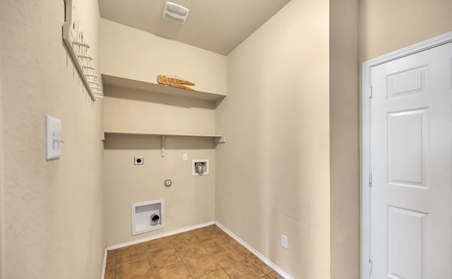 clothes washing area with hookup for a gas dryer, light tile patterned floors, washer hookup, and hookup for an electric dryer