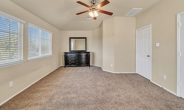 unfurnished bedroom with ceiling fan and light carpet