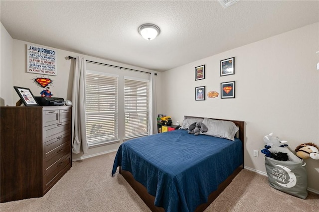 carpeted bedroom with a textured ceiling