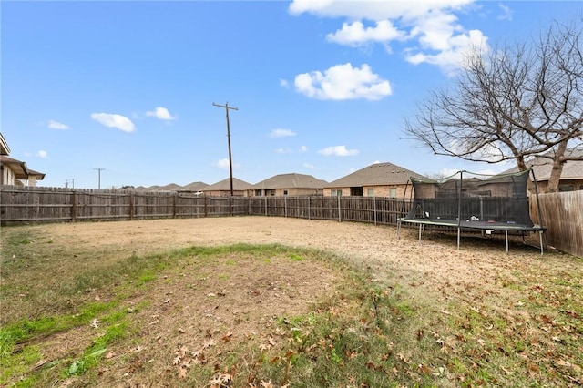 view of yard with a trampoline