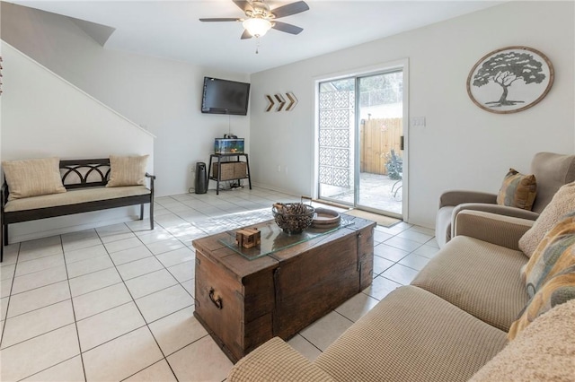 living room featuring light tile patterned floors and ceiling fan