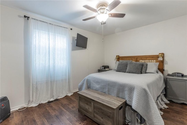 bedroom featuring ceiling fan and dark hardwood / wood-style flooring