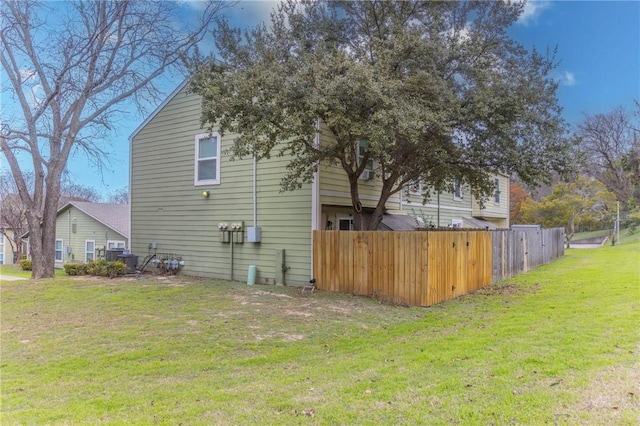 view of property exterior with a lawn