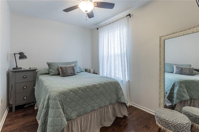 bedroom with multiple windows, ceiling fan, and dark hardwood / wood-style floors