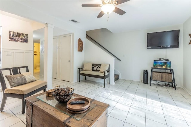 tiled living room featuring ceiling fan