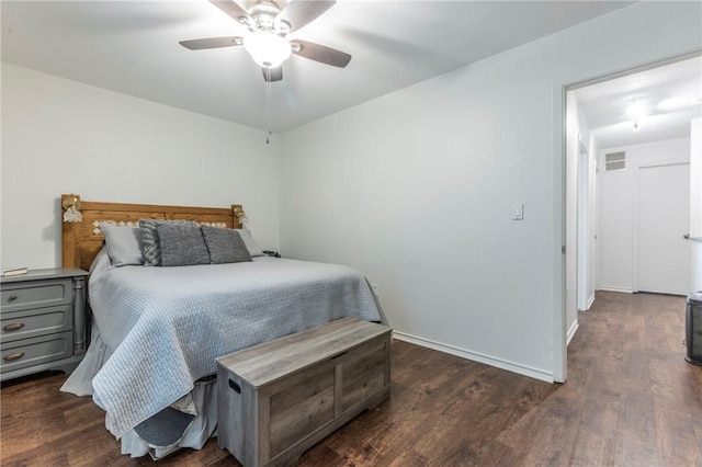 bedroom with ceiling fan and dark hardwood / wood-style floors