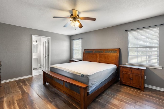 bedroom with a textured ceiling, ensuite bathroom, ceiling fan, and dark hardwood / wood-style floors