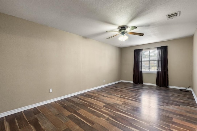 spare room featuring a textured ceiling, dark hardwood / wood-style floors, and ceiling fan