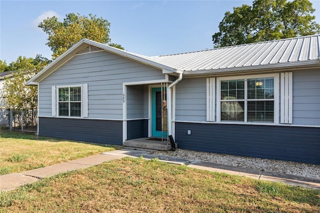 ranch-style home with a front yard