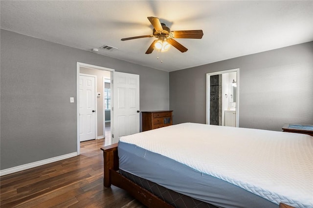 bedroom featuring ceiling fan, dark wood-type flooring, and ensuite bath