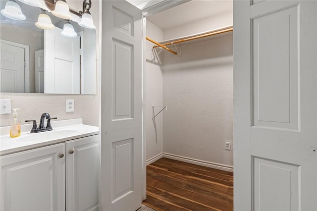 bathroom featuring vanity and hardwood / wood-style flooring