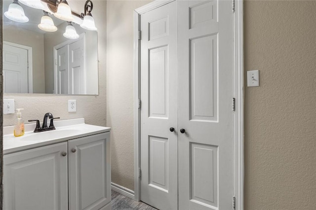 bathroom with vanity and hardwood / wood-style flooring