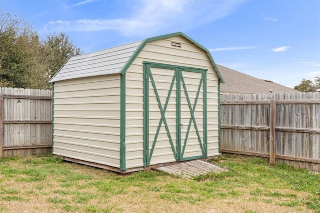 view of shed with a fenced backyard