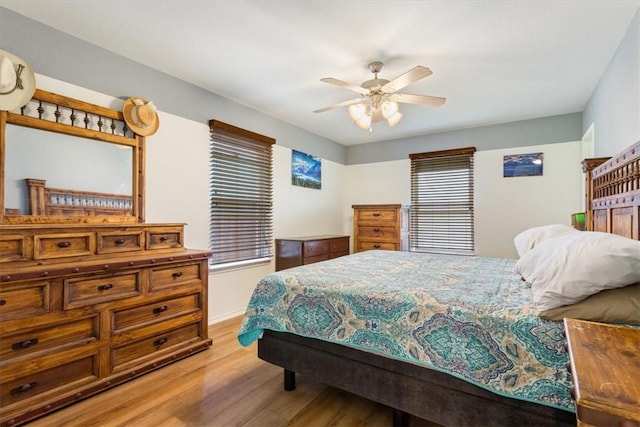 bedroom with light wood-type flooring and ceiling fan