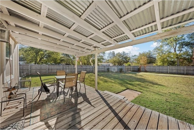 wooden deck featuring a yard