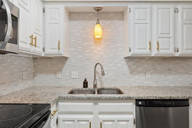 kitchen with sink, white cabinets, and stainless steel appliances