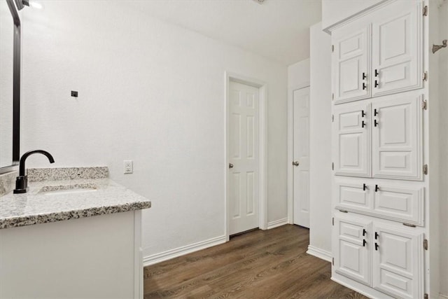 bathroom featuring hardwood / wood-style floors and vanity