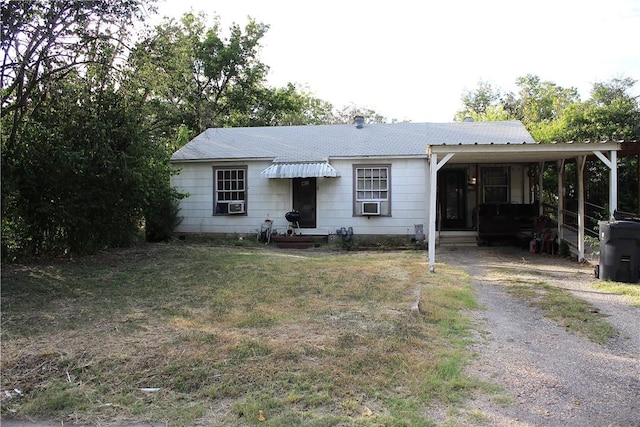 view of front of home featuring a carport