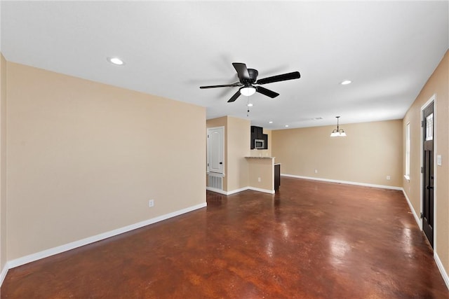 unfurnished living room featuring recessed lighting, finished concrete flooring, baseboards, and ceiling fan