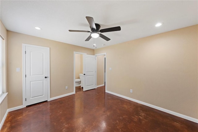 unfurnished bedroom with ensuite bath, recessed lighting, baseboards, and finished concrete floors