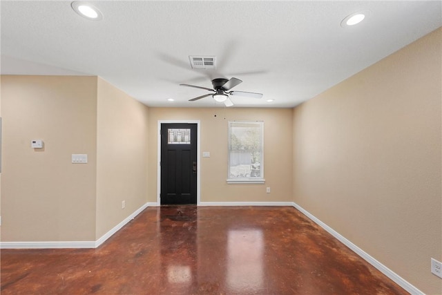 entryway featuring visible vents, a ceiling fan, finished concrete flooring, recessed lighting, and baseboards