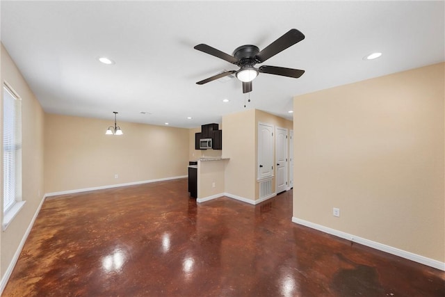 unfurnished living room featuring recessed lighting, baseboards, concrete flooring, and ceiling fan