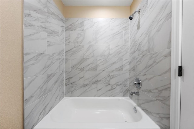 bathroom featuring washtub / shower combination