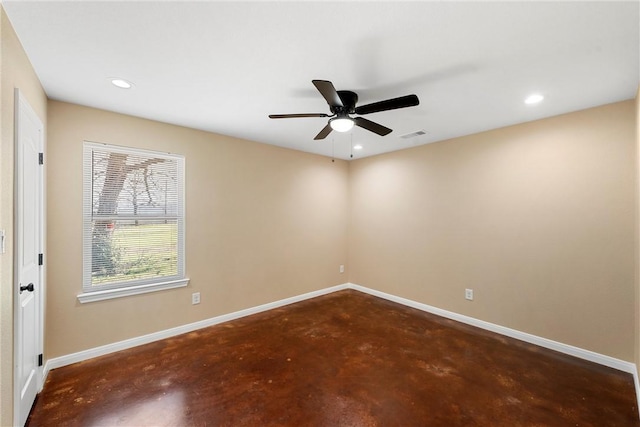 unfurnished room featuring recessed lighting, ceiling fan, concrete flooring, and baseboards