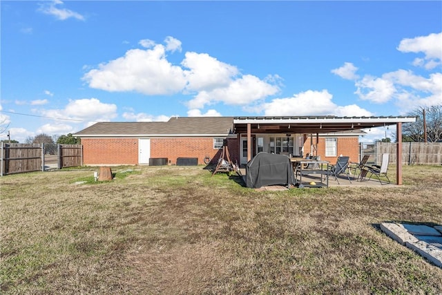 back of house with a patio area, a yard, and cooling unit