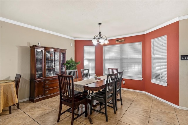 dining area featuring light tile patterned floors, an inviting chandelier, and ornamental molding