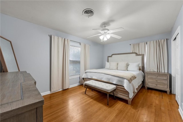 bedroom with ceiling fan and hardwood / wood-style flooring